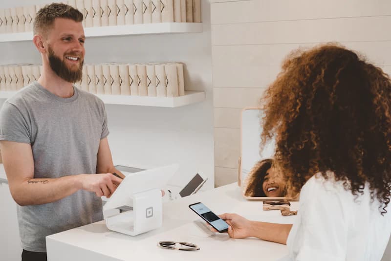 Shopper paying online with a card and laptop